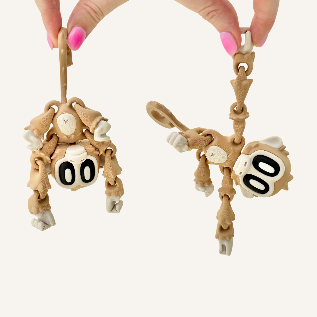 Flexible monkey sensory fidget with moving limbs, tail and 360 head movement for busy hands and stimming.