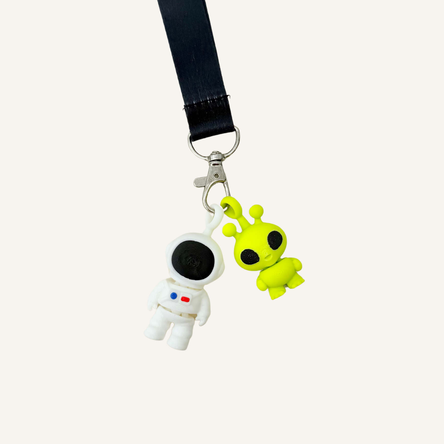 Small articulated astronaut fidget keyring for sensory regulation, busy hands and everyday grounding support.