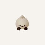 Cute mini baozi character with dangling legs designed for desks, shelves and calming decor spaces
