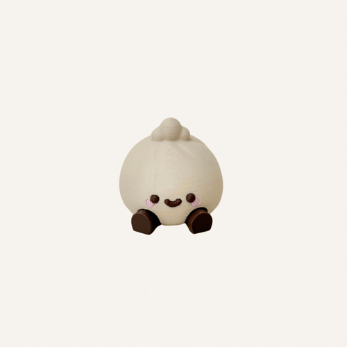 Cute mini baozi character with dangling legs designed for desks, shelves and calming decor spaces
