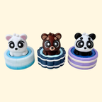 Cute bear clicker fidget sitting in a textured bath tub with a push-down click mechanism.
