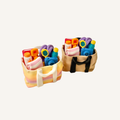Miniature beach bag sensory clicker filled with detailed holiday accessories and two click points.