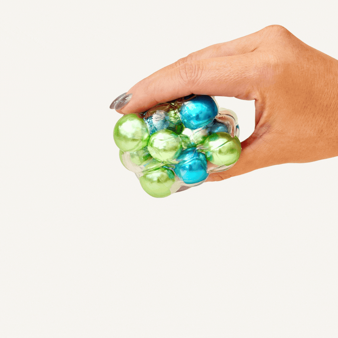 Bead-filled sensory fidget with tactile movement and noticeable sound feedback, designed for busy hands and sensory regulation.
