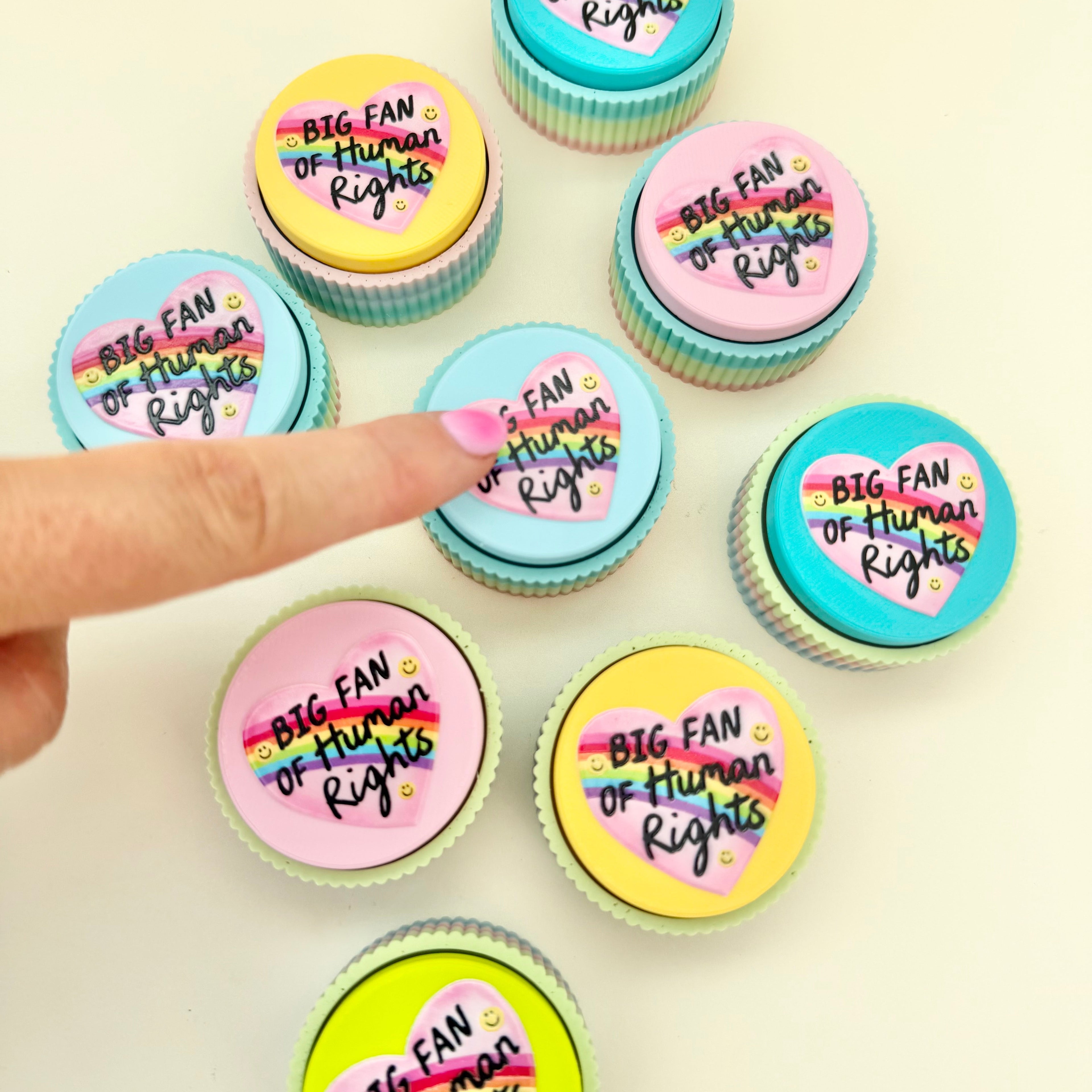 Big Fan of Human Rights clicker fidget with coloured top options and tactile button press.