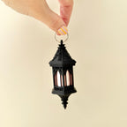 Decorative lantern keychain with subtle shimmer finish and tactile surfaces for calming input
