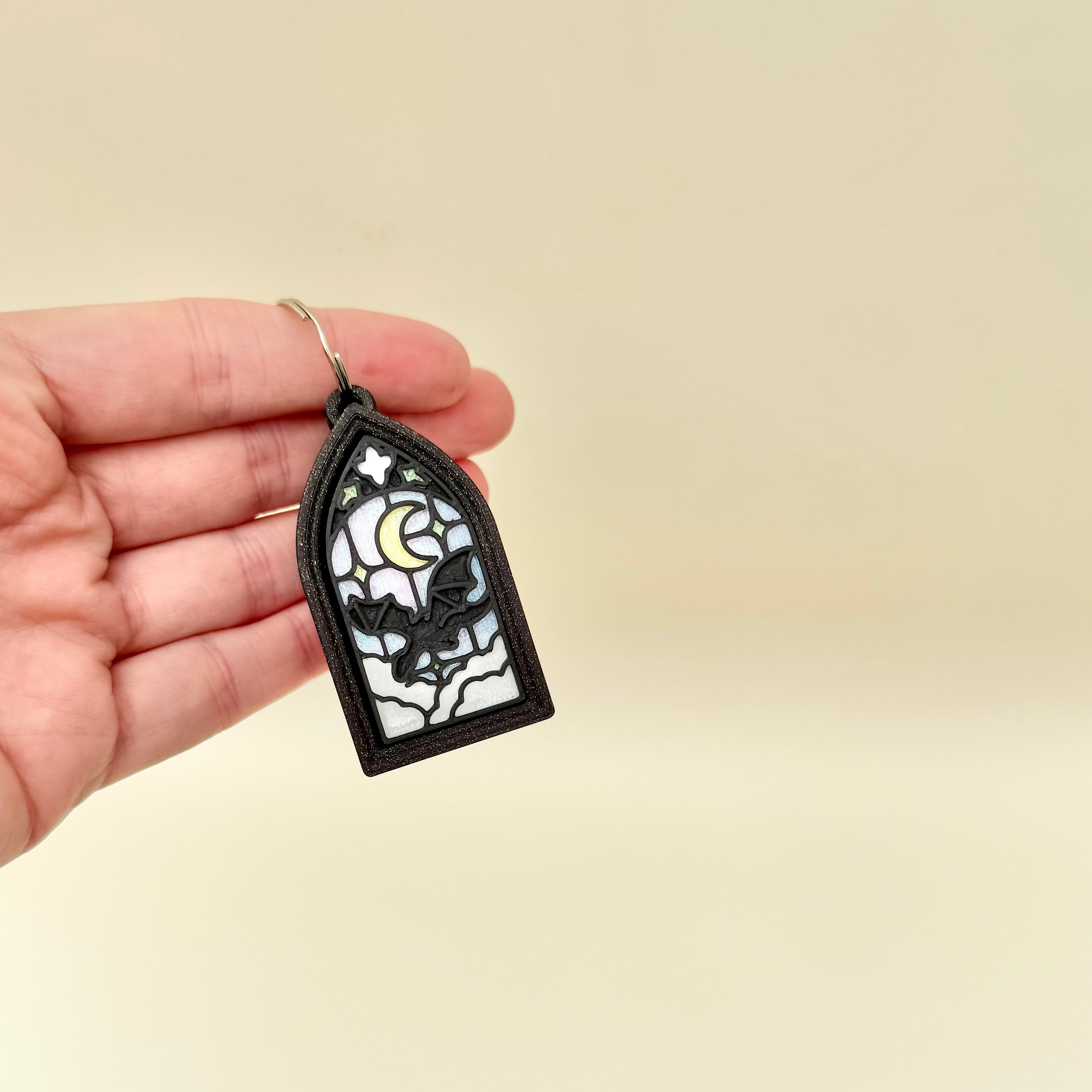 Small gothic clicker with detailed frame and coloured centre for visual interest and repetitive pressing.
