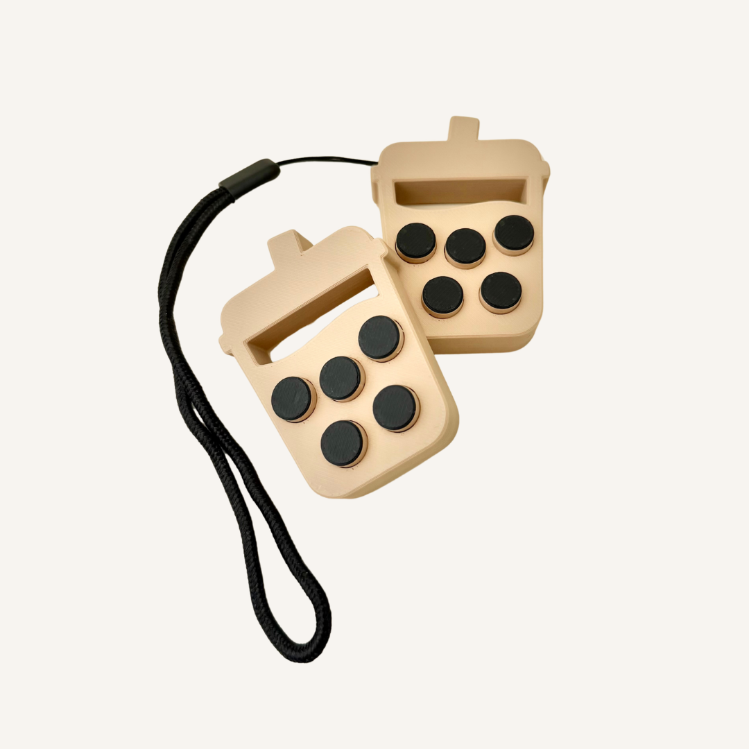 Bubble tea popback fidget with push-through bubbles, wrist strap and repetitive sensory feedback.