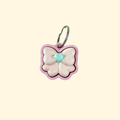 small pink bow fidget clicker on keyring, 3 cm handheld sensory toy with press-down top

