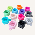 Modular letter clicker fidget with clickable blocks, ribbed texture and portable sensory use for desks, bags or lanyards.