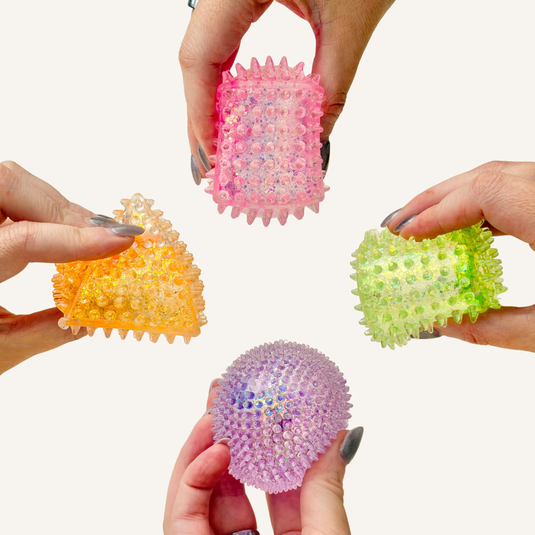 Sugar-filled bumpy sensory squish with slow-rise squeeze, glittery finish and tactile raised texture for fidgeting.
