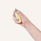 Soft yellow sensory putty in a reusable tin with a smooth buttery feel for quiet tactile fidgeting and desk use.
