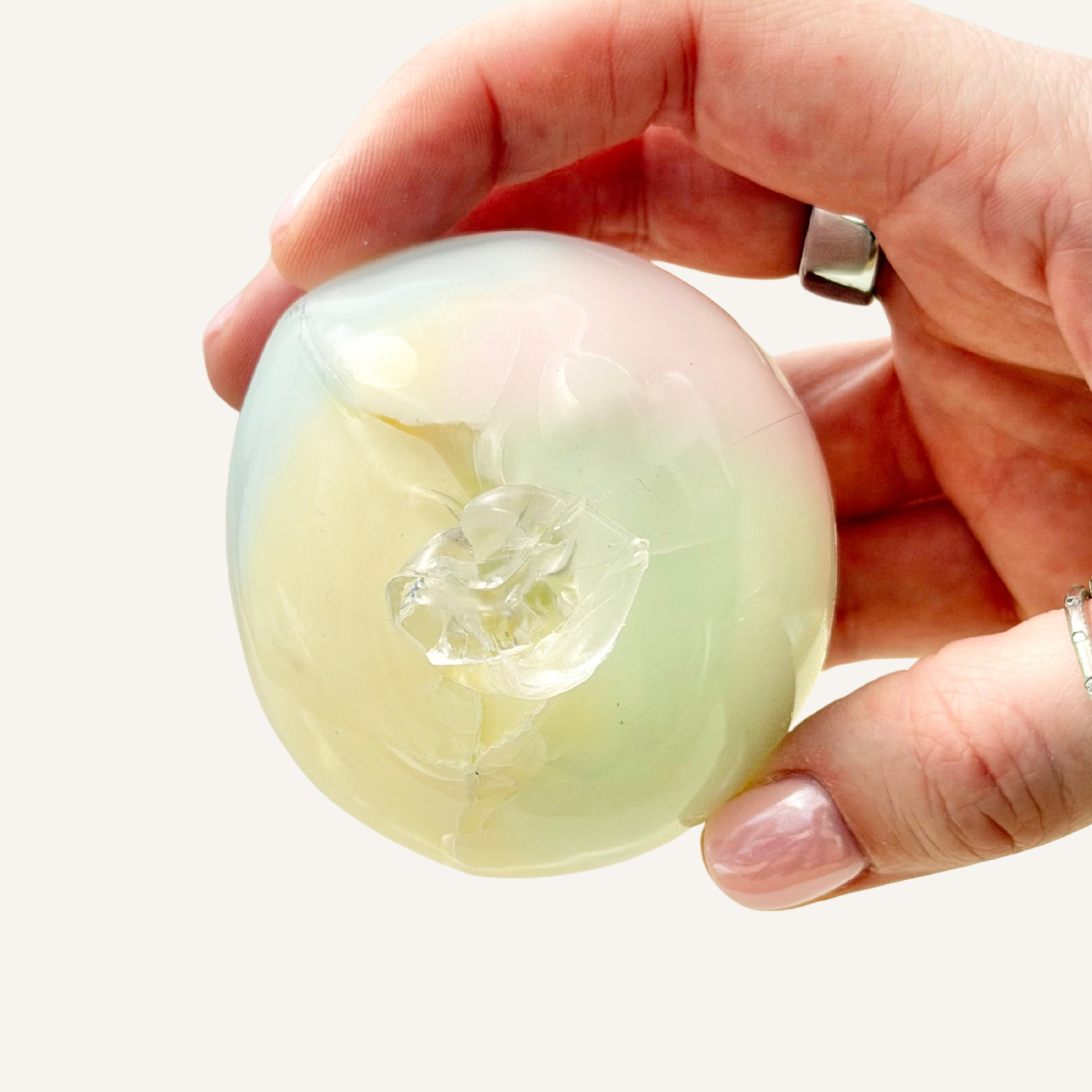 Sensory wax crack ball with clay-like filler that breaks and crumbles, then becomes a satisfying squish fidget.