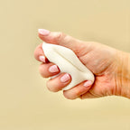 Palm-sized sensory squeeze toy for desk or travel, great for grounding and focus support.