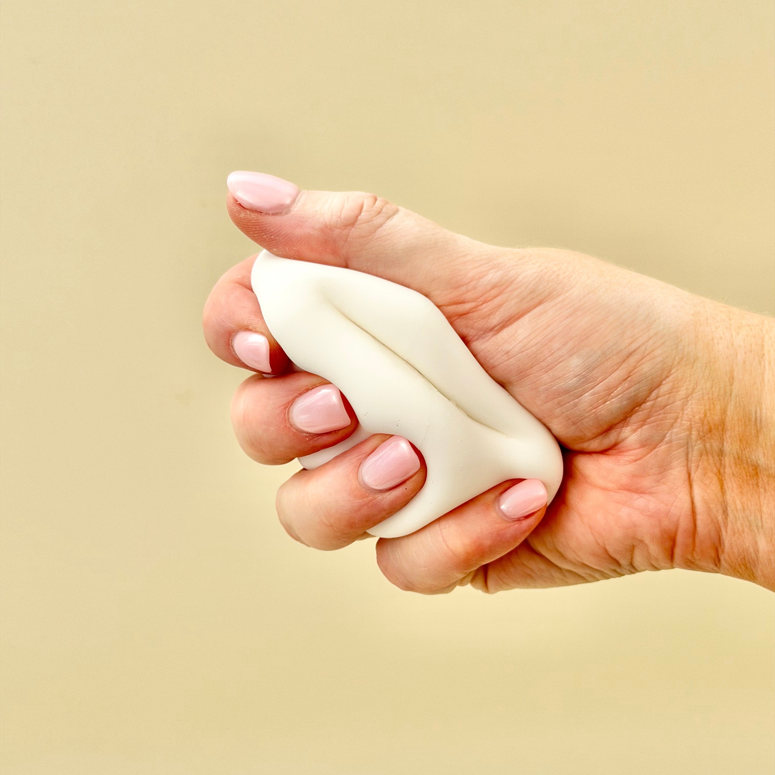 Palm-sized sensory squeeze toy for desk or travel, great for grounding and focus support.