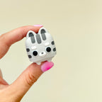 Cute cat sensory clicker with press-down movement for desk fidgeting, focus support and busy hands.
