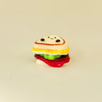 Handheld sensory squish with gentle squeeze and playful design for soothing busy brains.