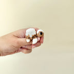 Small pastry-style turtle fidget with smooth glaze and textured details for tactile play.
