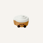 Cute mini cinnamon roll character with dangling legs designed for desks, shelves and cosy decor spaces
