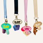 Oval tag with raised wording and keyring loop for simple, practical communication support.