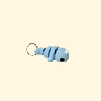 Wearable sensory tool on a silver ring loop, designed for discreet fidgeting, routines, and everyday carry.
