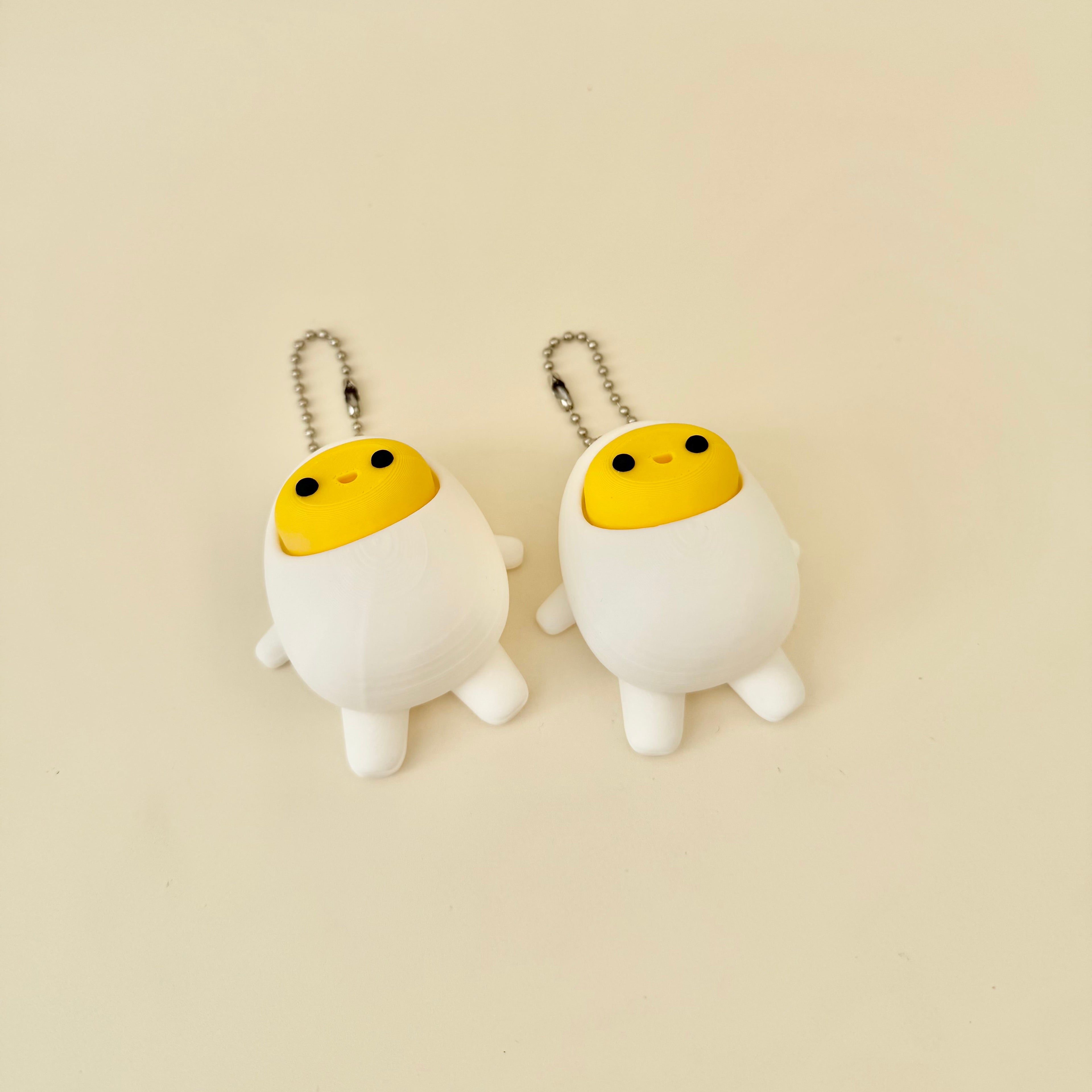 Small handheld sensory clicker keyring with smooth finish and satisfying yolk press, great for busy hands on the go.
