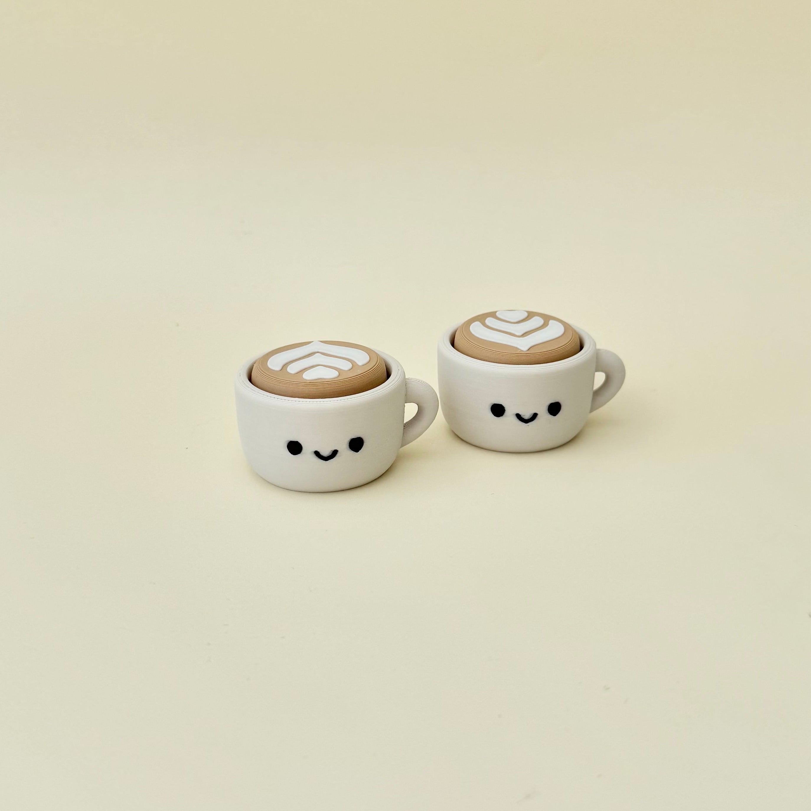 Small coffee cup desk fidget with built-in clicker, smooth finish and everyday sensory feedback.