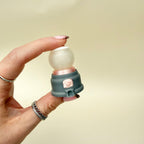 Small press-and-click sensory fidget for desk use, fun giftable design with tactile press feedback.
