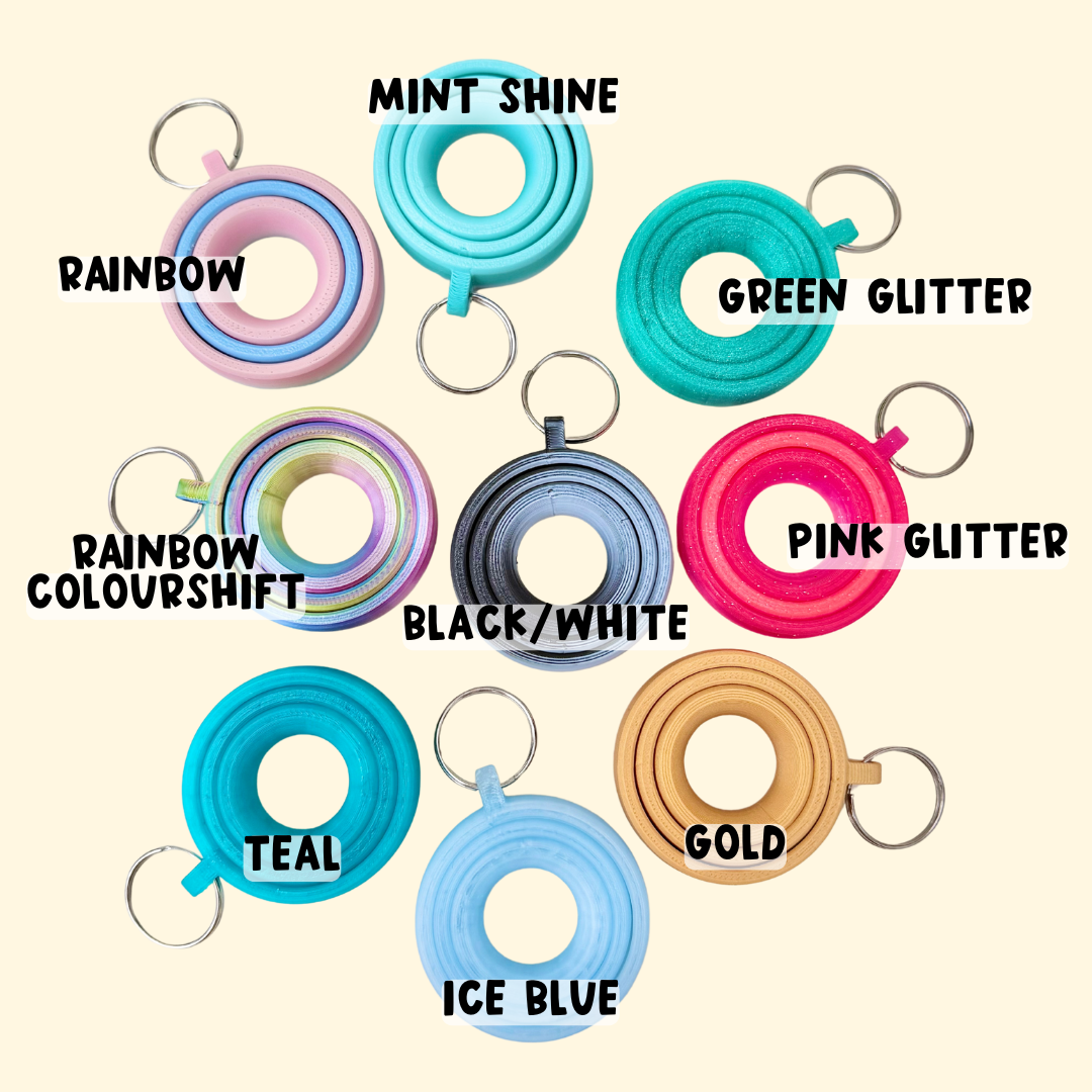 Quiet clip-on spinner fidget in multiple colour options, designed to pair with lanyards for daily use.
