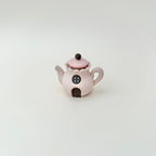 Desk-friendly teapot fidget that doubles as a cute decorative piece.
