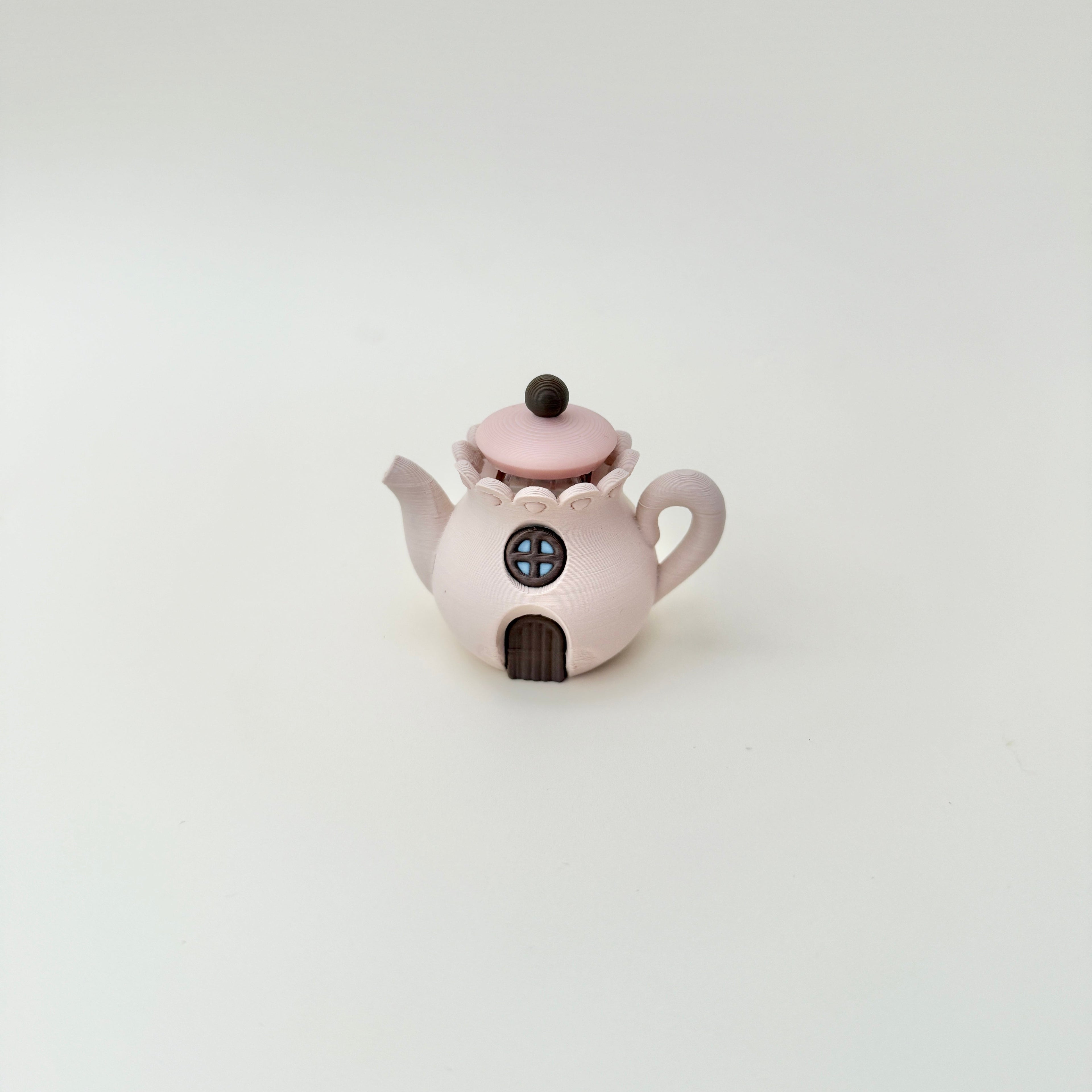 Desk-friendly teapot fidget that doubles as a cute decorative piece.
