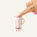 Cute desk fidget with built-in clicker, smooth finish and weighty feel for sensory regulation and stimming.