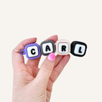Linked name fidget with clickable letter blocks, textured edges and portable sensory feedback for everyday use.