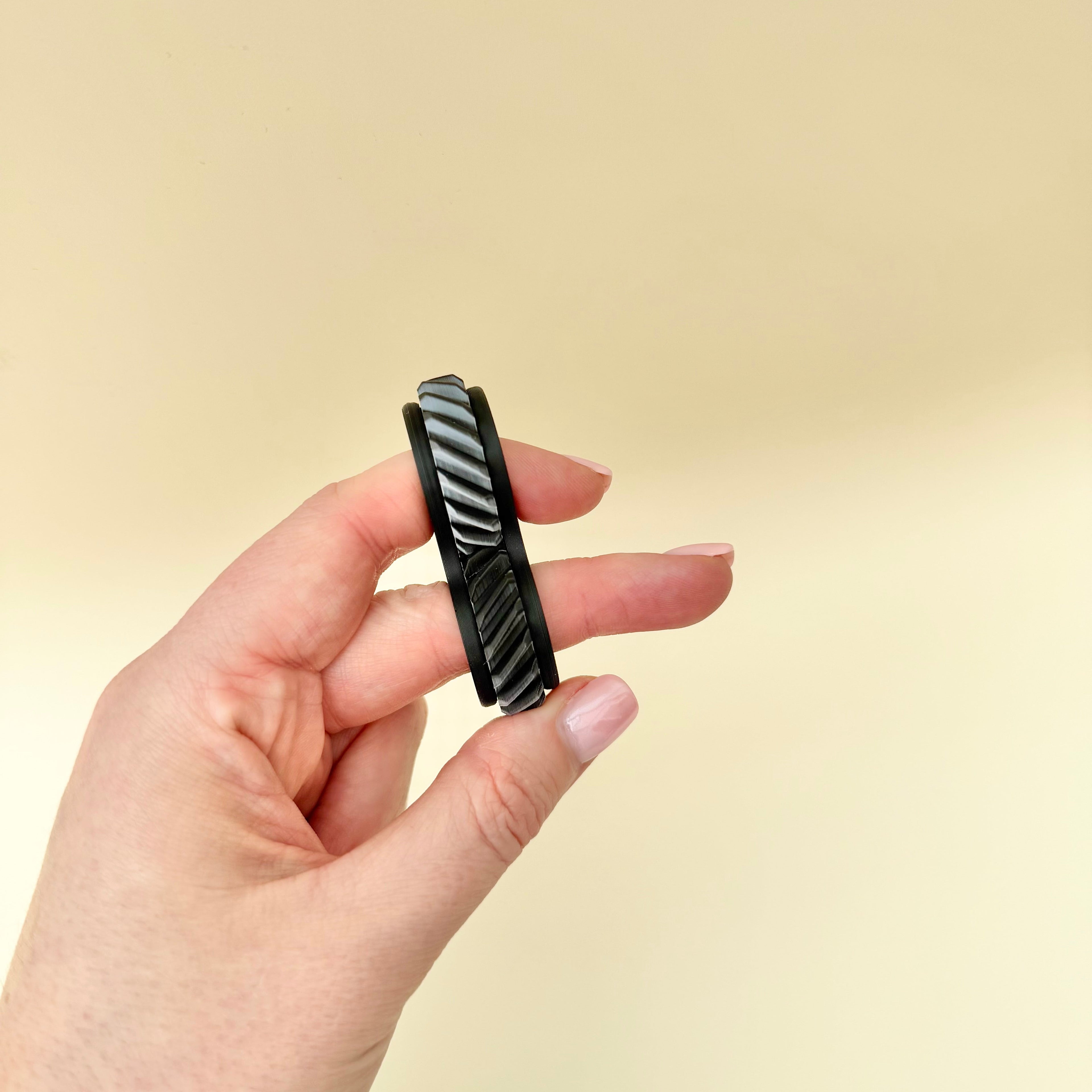 Customisable rolling fidget with frame and wheel colour choices for everyday sensory regulation and stimming.