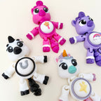 Handheld animal-shaped clicker fidget with flexible body and interchangeable button icon options.
