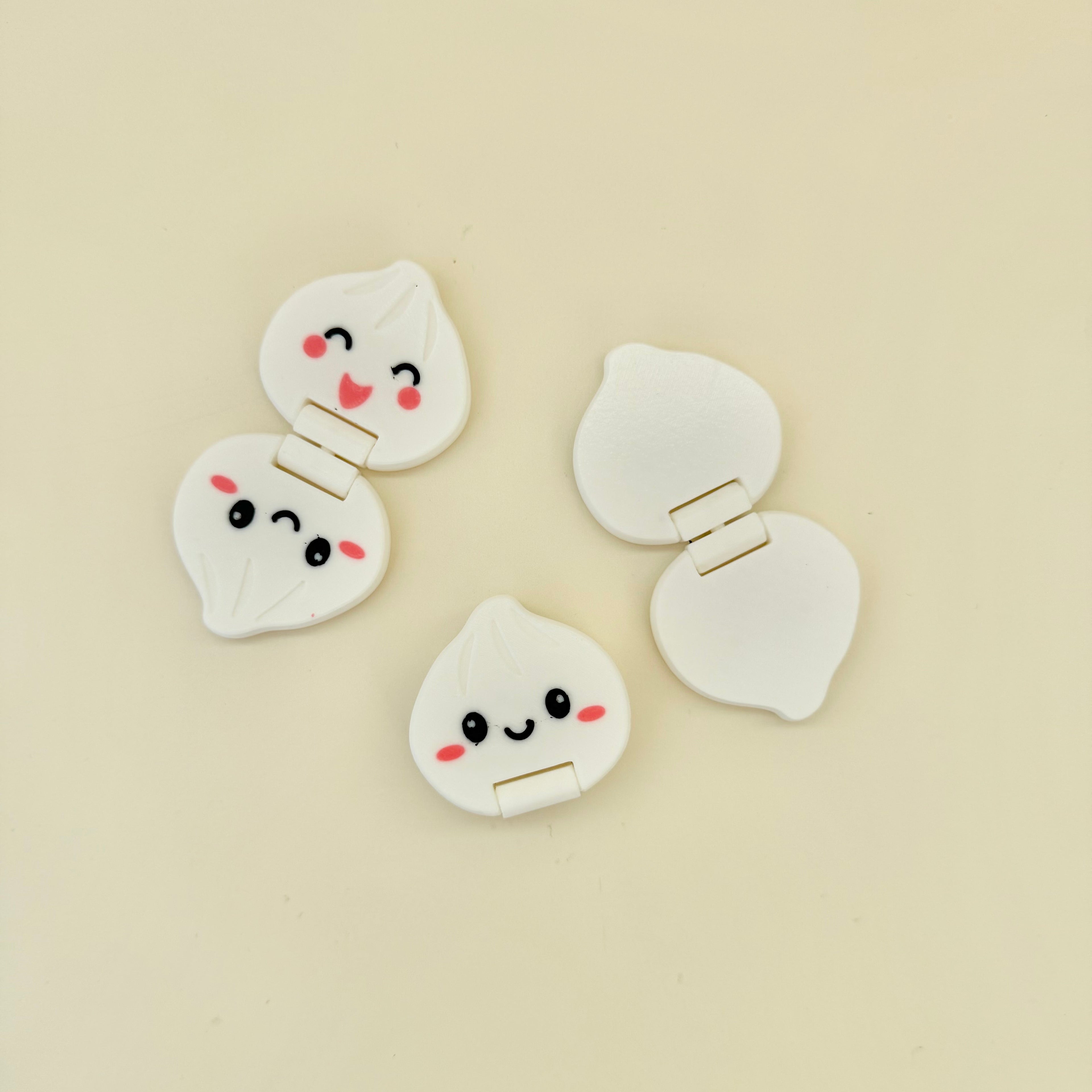 Small cute fidget with smooth dumpling shape, foldable movement and sensory regulation support.