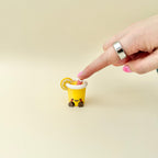 Lemon cup fidget with pressable clicker for grounding, sensory regulation and repetitive hand movement.