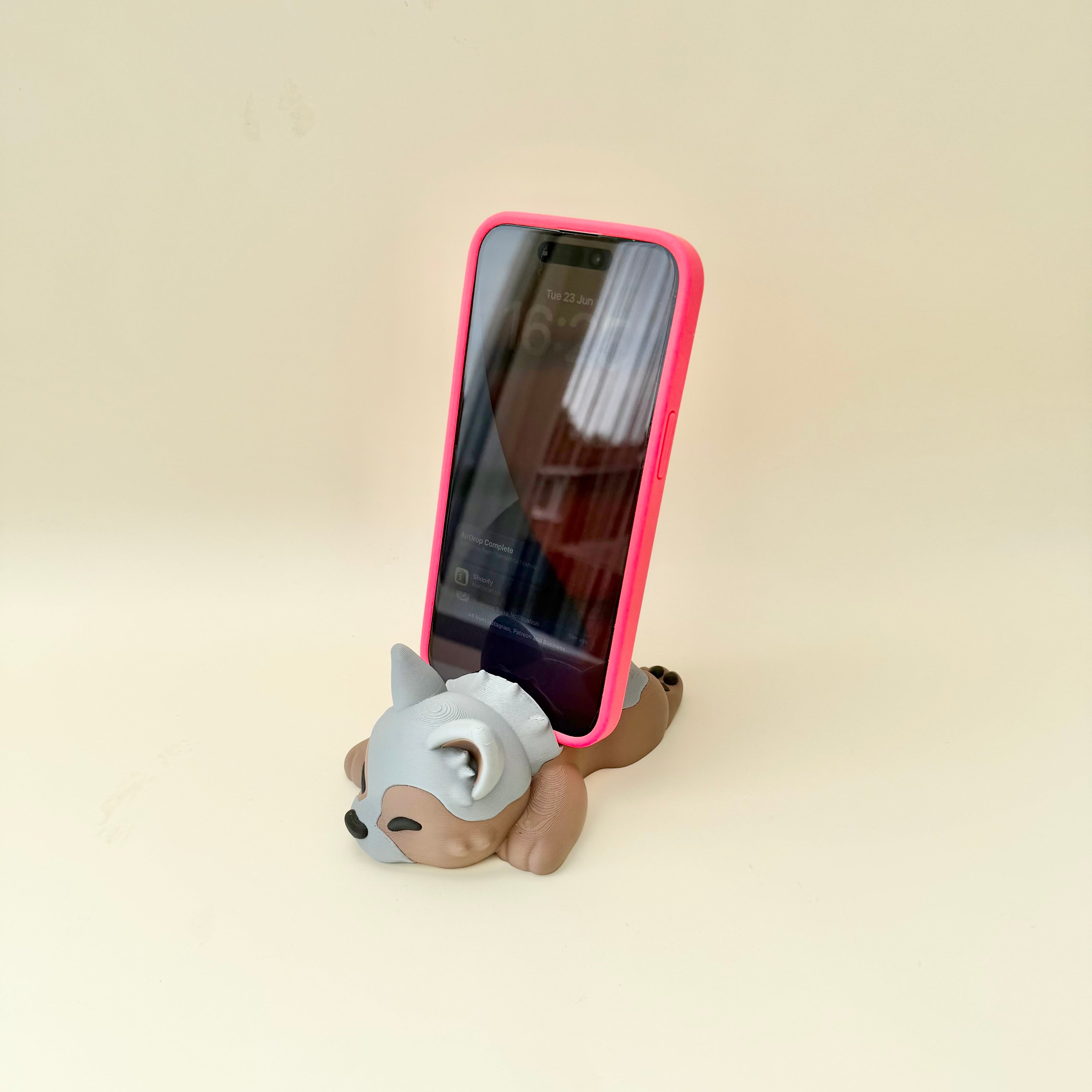 3D printed cute phone holder with sleepy puppy design for workspaces, bedrooms and cosy desk setups.