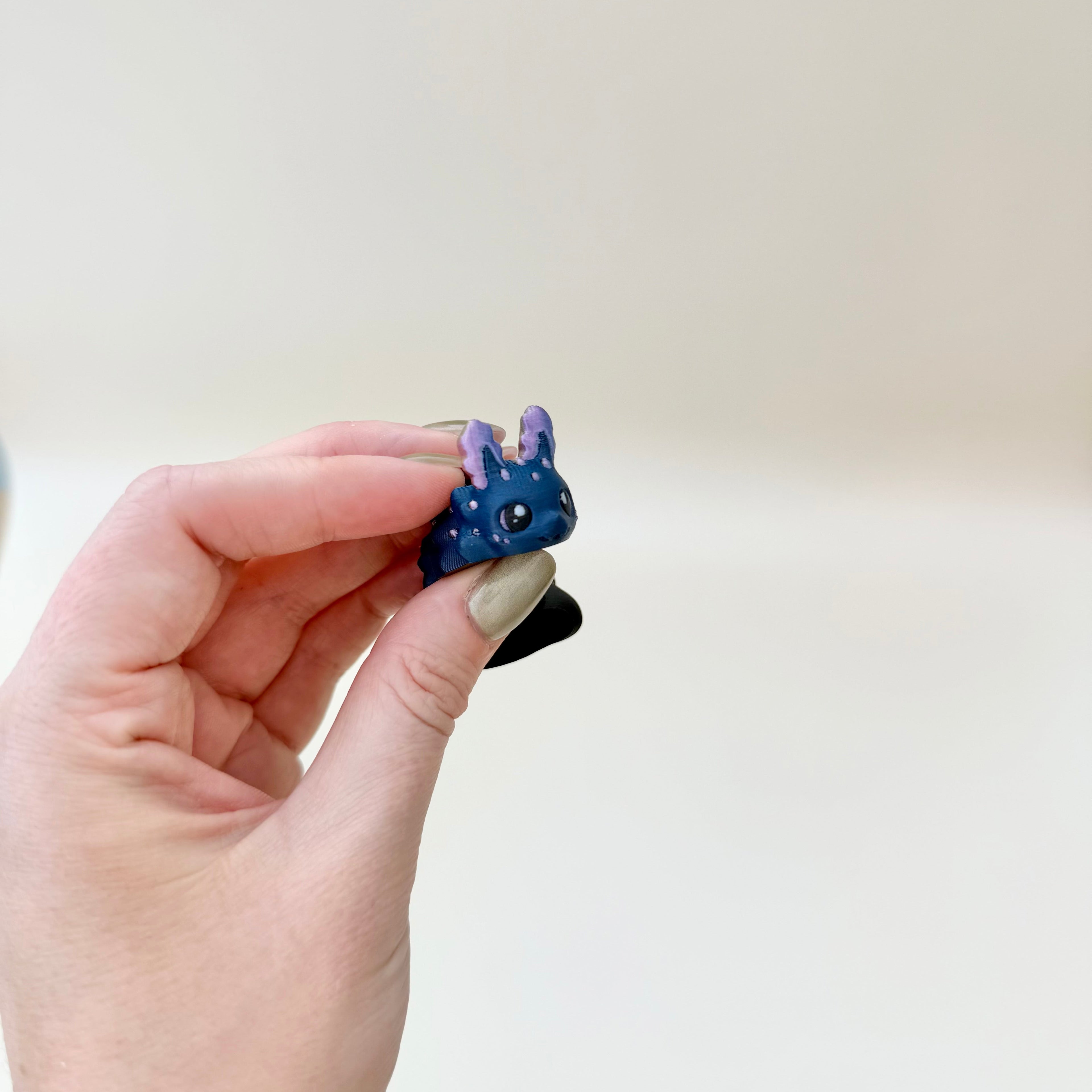 Mini creature-inspired fidget with detailed texture and flexible movement for tactile play.
