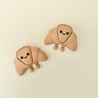 Soft-feel handheld fidget with subtle movement and a character design suited for calm, low-stimulation use