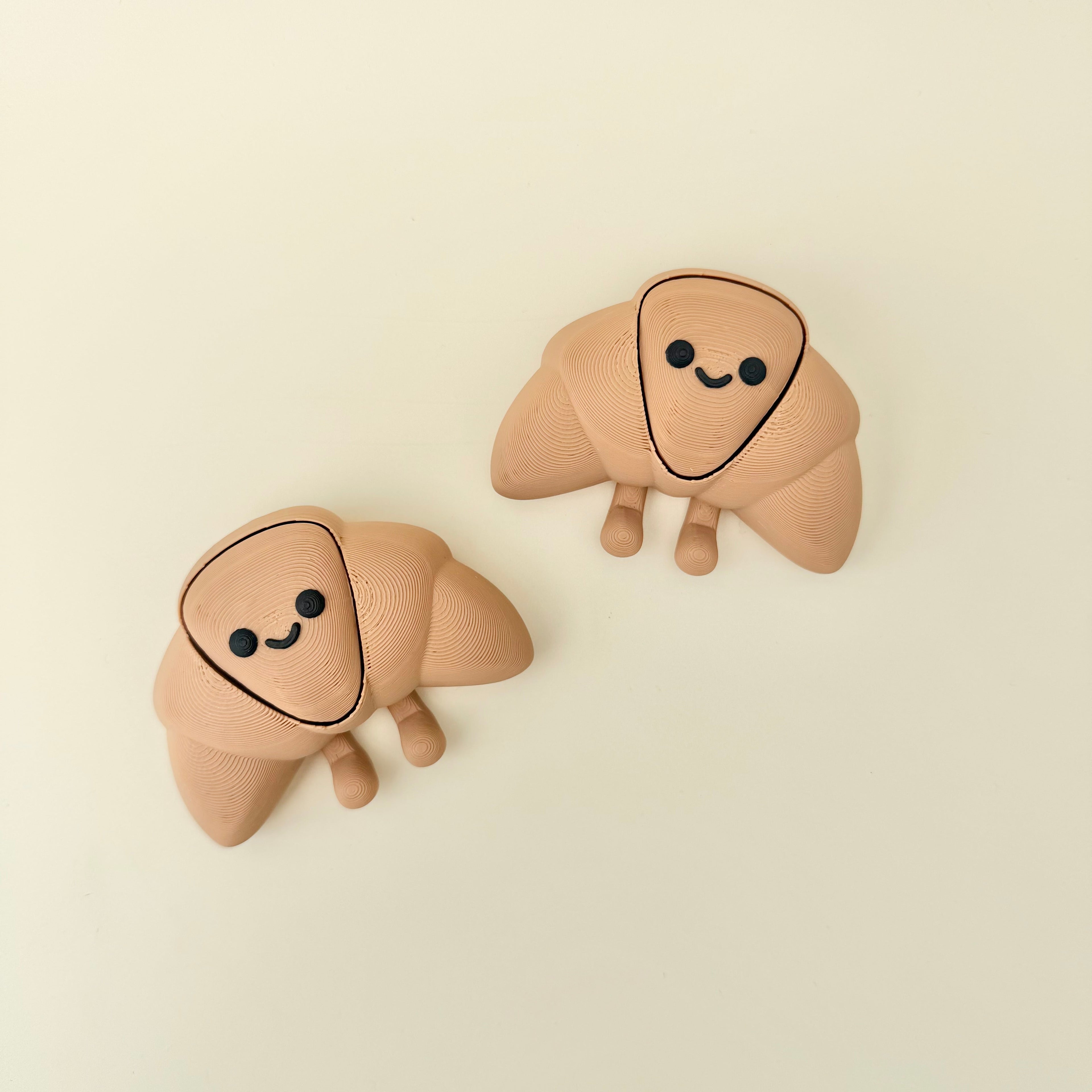 Soft-feel handheld fidget with subtle movement and a character design suited for calm, low-stimulation use
