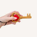 Ornate key inspired fidget combining visual detail with click action for focus and sensory regulation.
