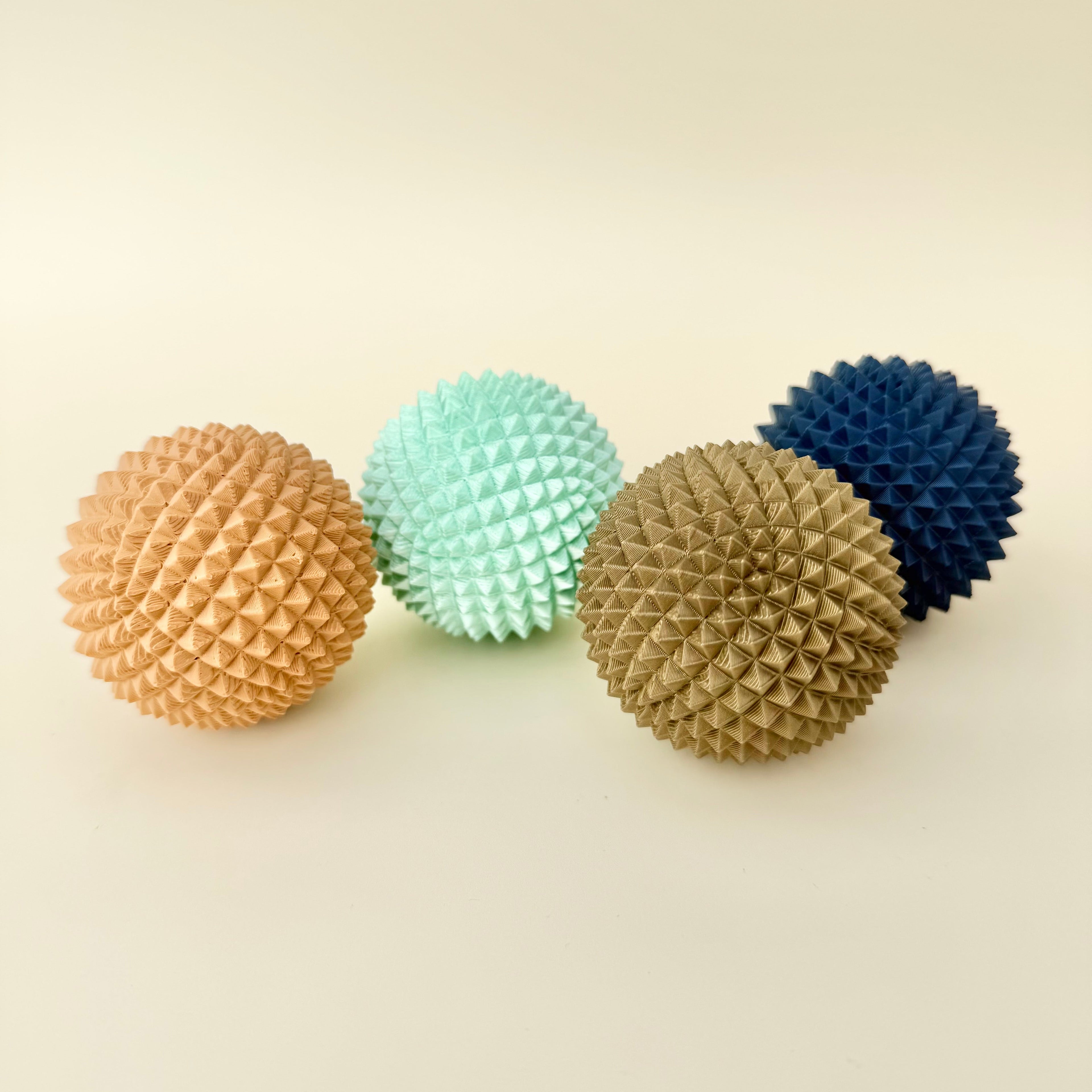 Handheld spiky support tool offering intense tactile input for regulation and focus.
