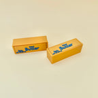 Novelty butter bar desk fidget with smooth texture, raised details and repetitive click feedback.