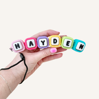 Custom desk clicker with multiple pressable letters for ADHD fidgeting, focus support and tactile regulation.