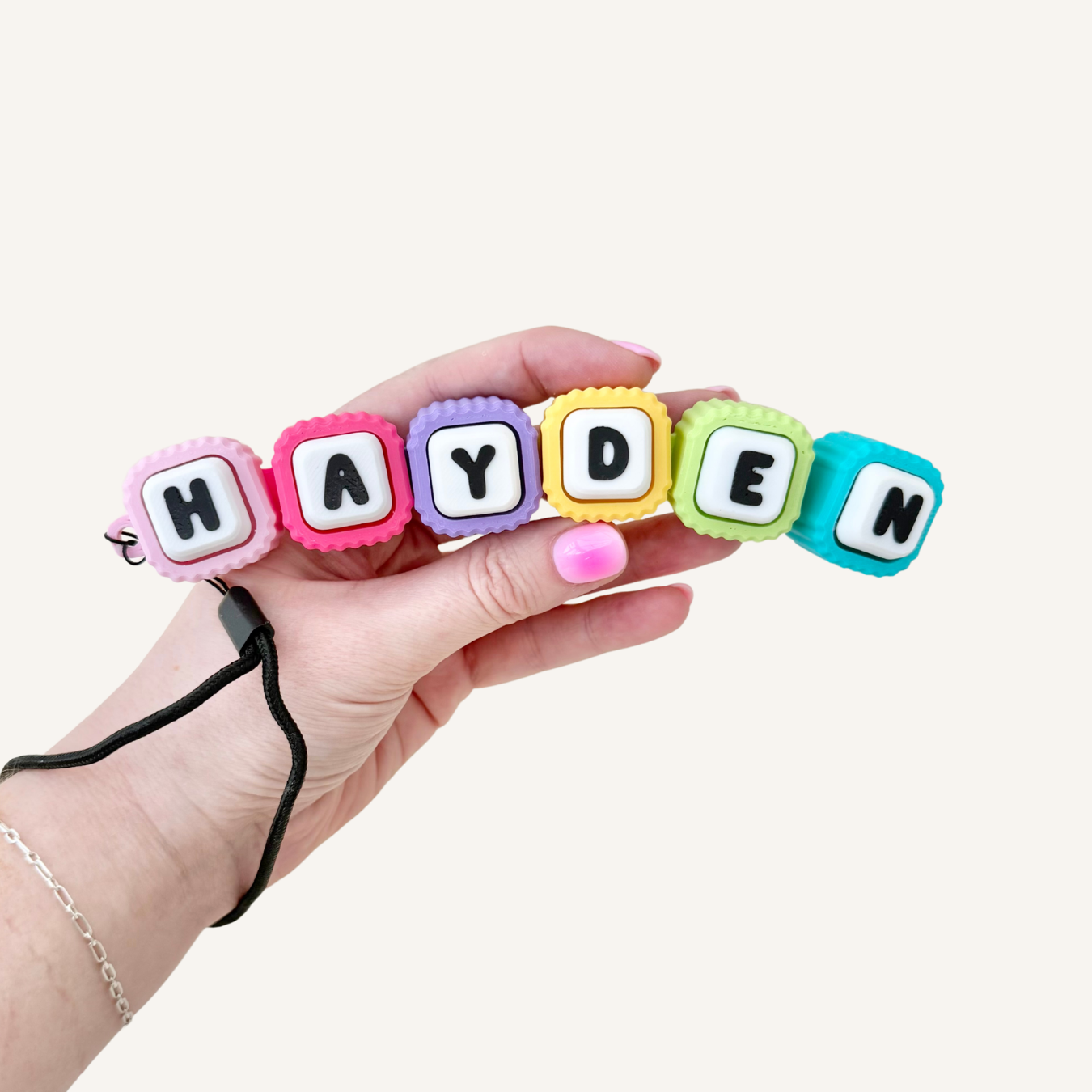 Custom desk clicker with multiple pressable letters for ADHD fidgeting, focus support and tactile regulation.