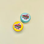 Small desk clicker with bold human rights message, click feedback and sensory regulation support.