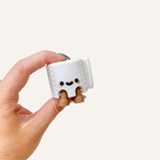 Cute mini character with dangling legs designed for desks, shelves and bedside display in neuro-friendly spaces
