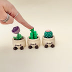 Cute desk fidget disguised as a plant pot with a hidden press-down click.