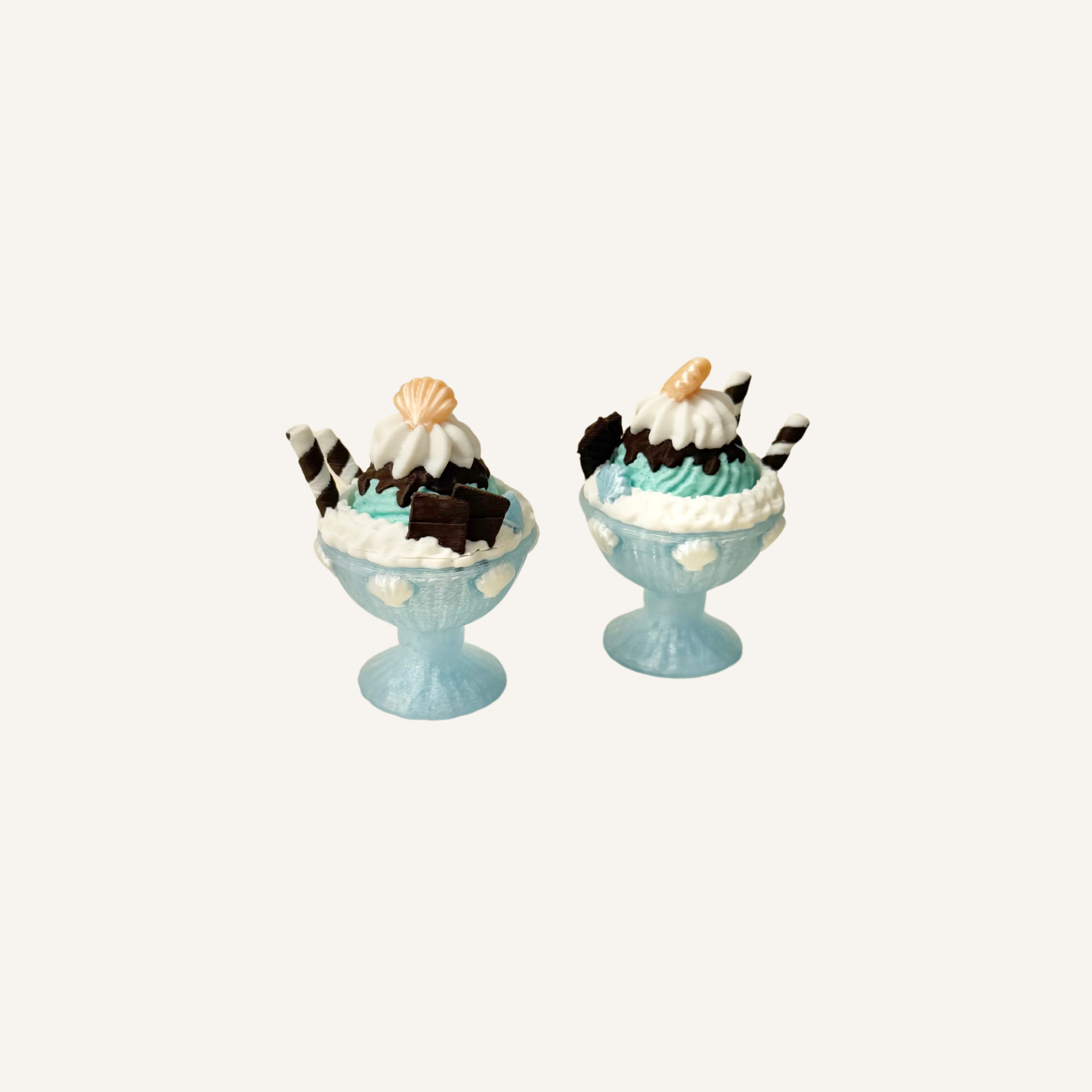 Ice cream sundae sensory clicker shown from above with detailed dessert toppings.