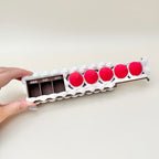 Decorative pill box for daily supplements that blends into a desk or shelf and doesn’t look clinical.

